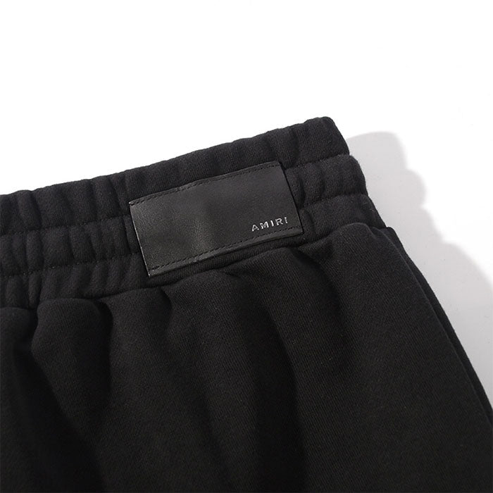 AMIRI Zoltar Tapered Logo-Print Cotton-Jersey Sweatpants