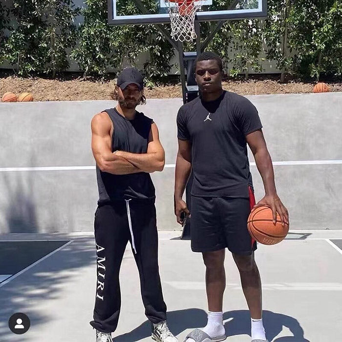 AMIRI Zoltar Tapered Logo-Print Cotton-Jersey Sweatpants